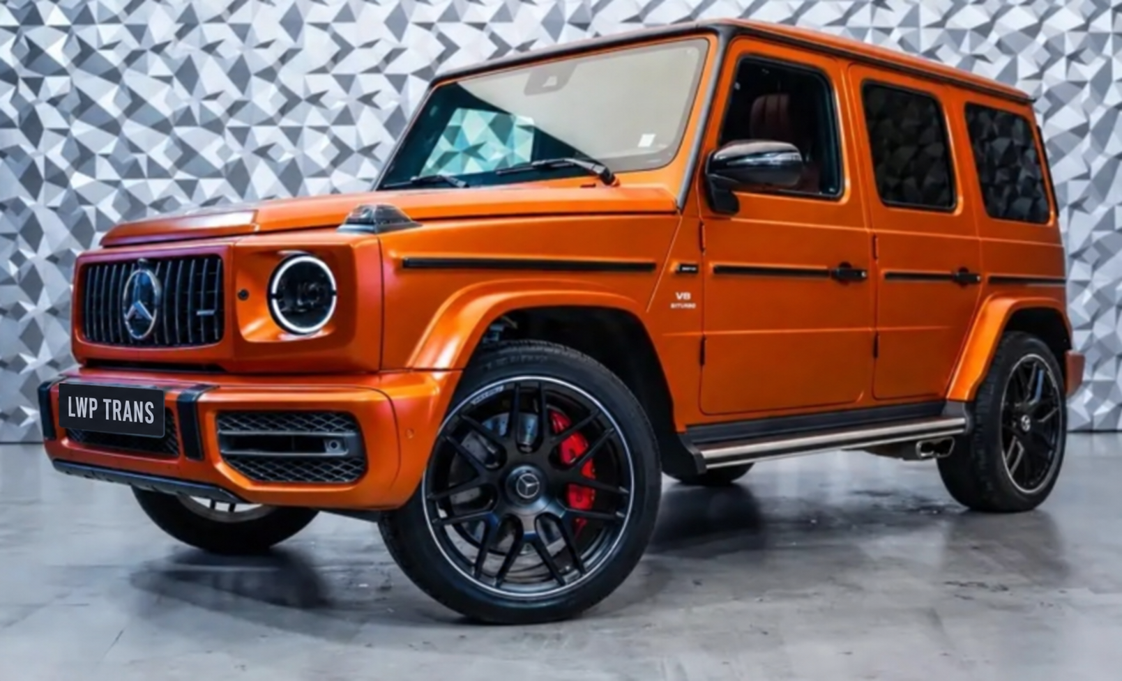 Orange Mercedes-Benz G-Class, front three-quarter view