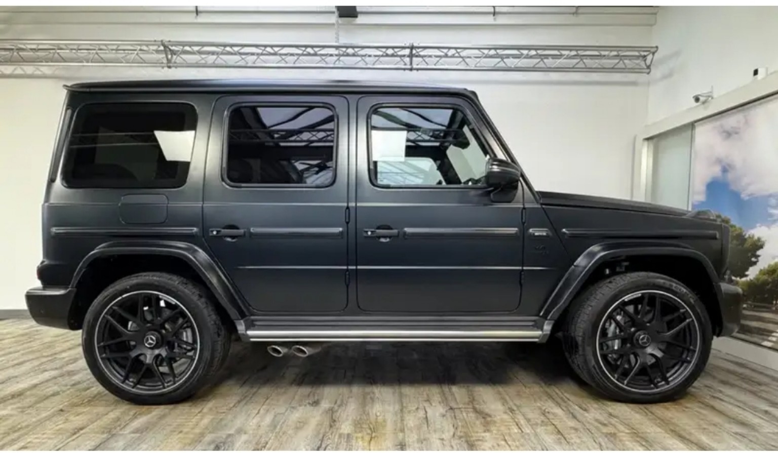 Dark Mercedes-Benz G-Class in side profile